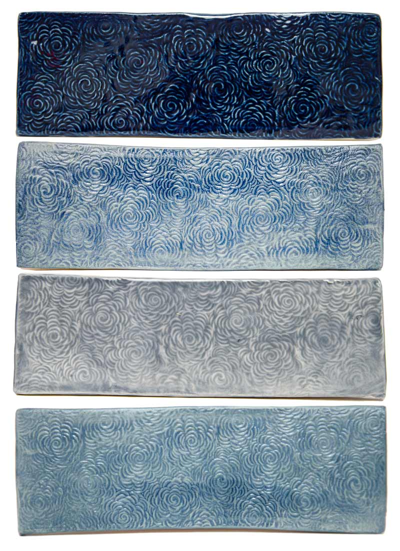 Navy blue glaze on handmade floral textured bathroom tiles shades